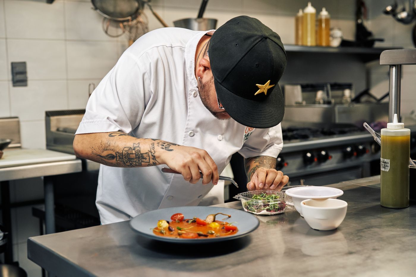 Chef carefully plating a dish