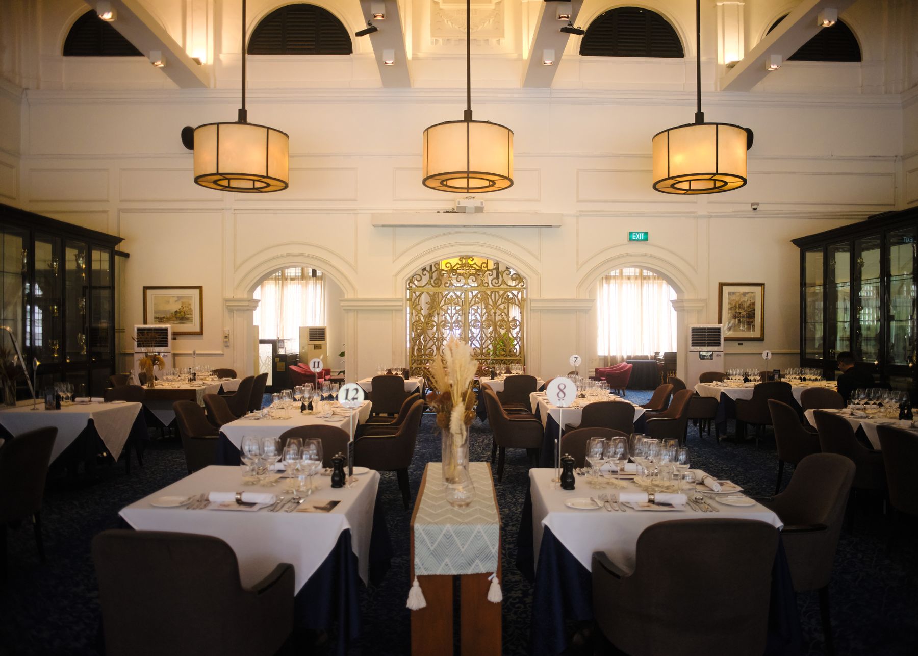Elegant restaurant interior with warm pendant lighting and beautifully set tables