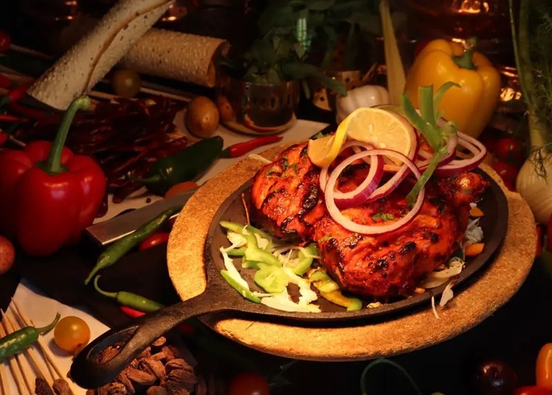 Chef preparing tandoori chicken