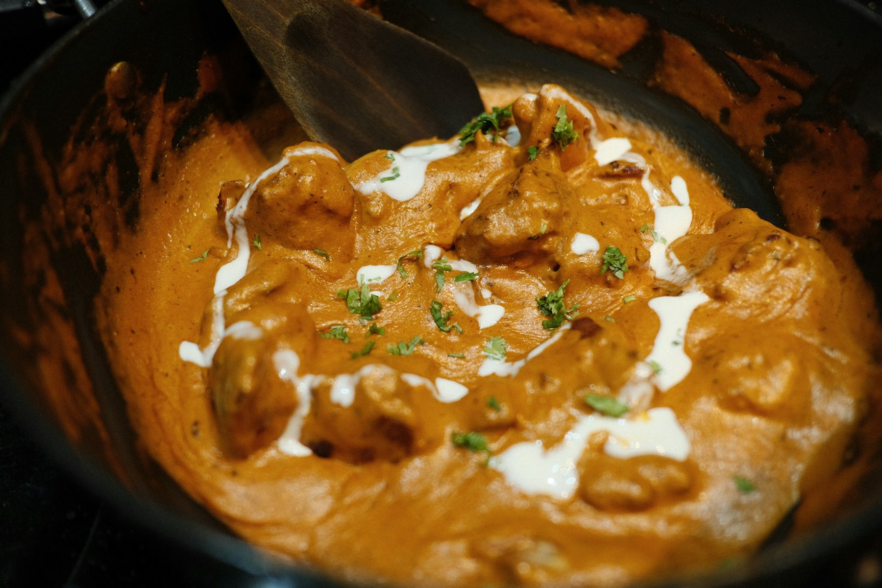 Indian curry served with fresh herbs